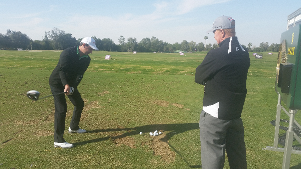 Peter Lawrie under the watchful eye of coach Jamie Gough. (Photo - www.golfbytourmiss.com)