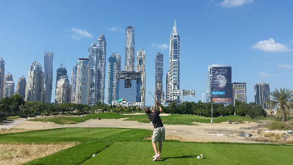 Frank hitting off the par three, 8th hole of the Faldo Course at the Emirates GC.