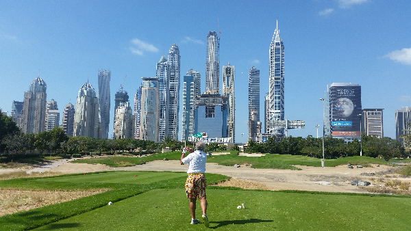 PJ hitting off the tee at the par three, 8th hole.