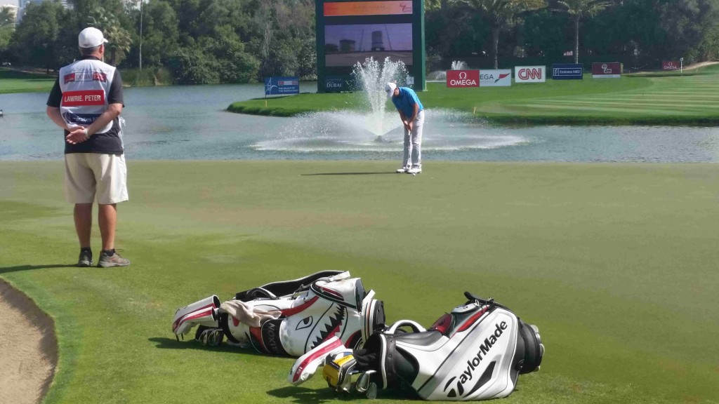 Peter Lawrie putting out for bogey at the final hole on the last day of the 2015 Dubai Desert Classic.  (Photo - www.golfbytourmiss.com)