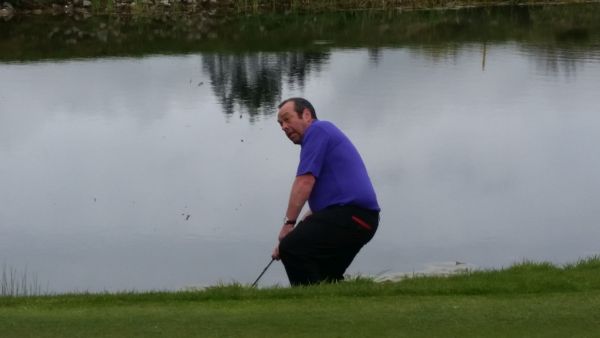 Davy Patterson hitting into the par five 6th green.