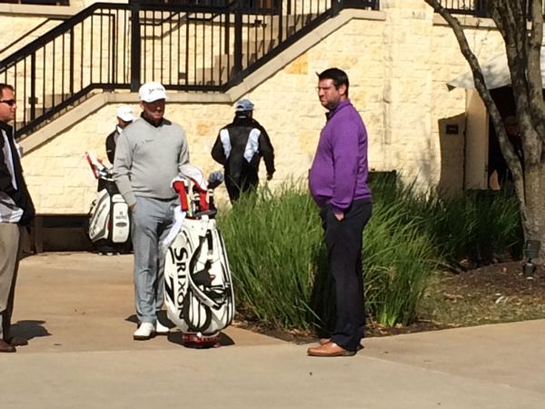 Graeme McDowell with his manager Colm Morrissey (purple top) after withdrawing from the 2015 Valero Texas Open. (Photo - James Haddock/SKY Sports)