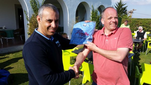 Roger Watson proudly accepts an Estoril Golf Club shirt.