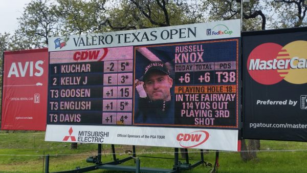Russell Knox features on giant screen beside 18th fairway.