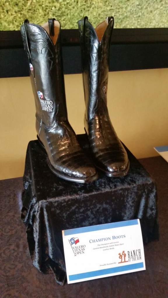 A pair of Texas cowboy boots awaits the winner of the 2015 Valero Texas Open.  (Photo - www.golfbytourmiss.com)