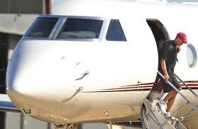 Tiger Woods emerging from his private jet.