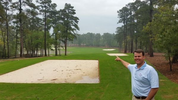 Eric Bauer, Director of Agronomy points the way down the 1st hole at BlueJack National.
