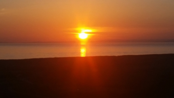 Sun setting over Trump Turnberry.