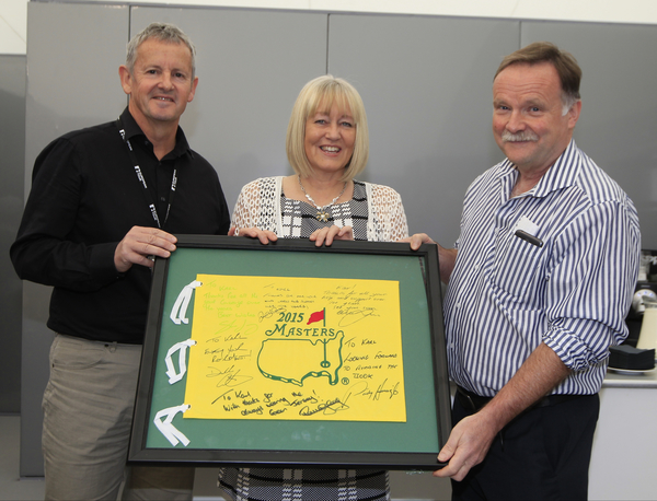 Derek Lawrenson (left) and President of the AGW along with Karl MaGinty's wife Mary with the presentation of the Masters flag to Karl.