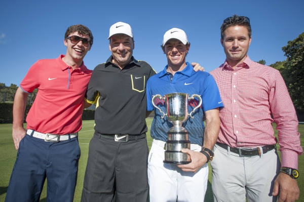Mitchell Tweedie (left) with McIlroy along with caddy J P Fitzgerald manager Sean O'Flaherty (right) following McIlroy's 2013 Australian Open success.