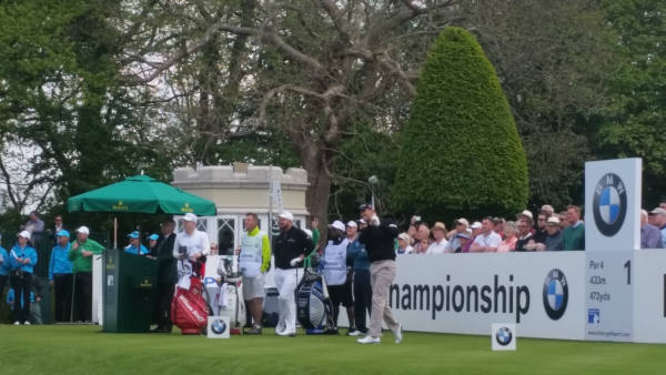 The pain seems to be etched on Padraig Harrington's face as he drives off Wentworth's first hole.