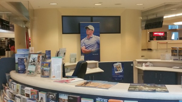 Hiding behind the Information counter at Jacksonville Airport - World No. 1 Rory McIlroy.