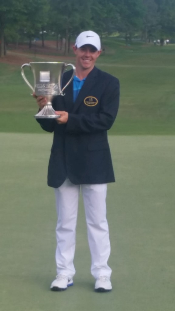 World No. 1 Rory McIlroy finds his way into another victory jacket but it's a lighter Augusta National green coloured item of apparel he still so desperately seeks. (Photo - www.golfbytourmiss.com)