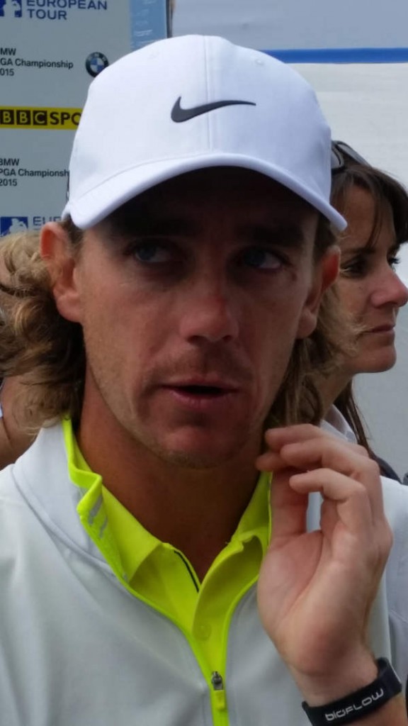 Tommy Fleetwood and his manager Clare in the background behind the 24-year old England golf star.