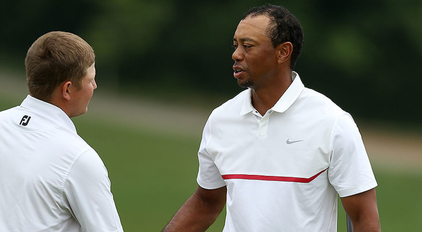 Former Memorial champion Tiger Woods shakes hands with Zac Blair after posting a 13-over par 85 and the 14-time Major winner's worst round as a professional. (www.pgatour.com)