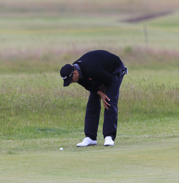 Adam Scott (AUS) examines his lie at the 15th green during the first round of the 144th Open Championship, St Andrews Old Course, St Andrews, Fife, Scotland. 16/07/2015. Picture Eoin Clarke, www.golffile.ie
