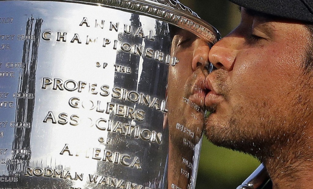 Jason Day plants a kiss on the Rodman Wanamaker Trophy.
