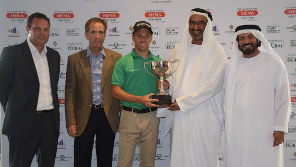 Gary King receiving the winner’s trophy from Khalfan Al Kaabi, chairman of the Ascorp Holdings, as Mohamed Juma Bumaim, chairman of the MENA Golf Tour, Mark Chapleski, senior vice president of Troon Golf, and Scott McCaw, Director of Club Operations, look on at Saadiyat Beach Golf Club