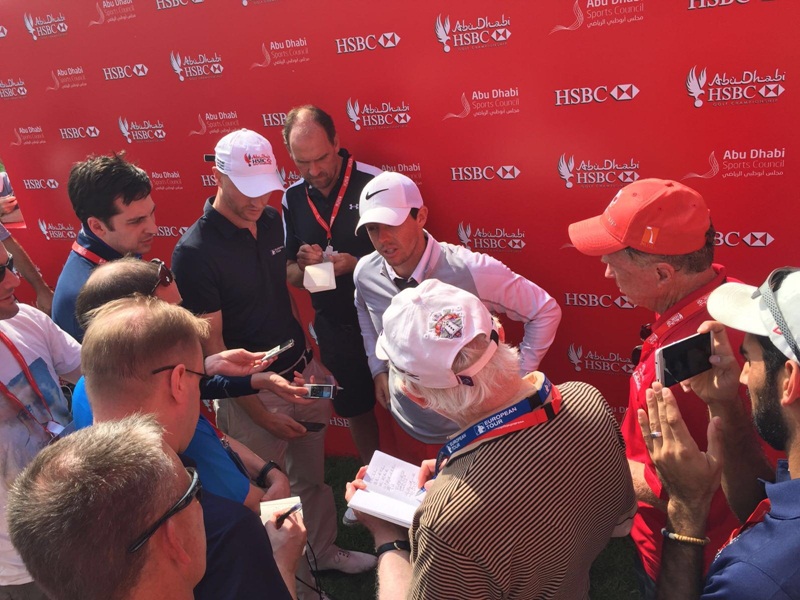 Bernie (red cap) in frame as Rory McIlroy talks about finally completing his second round,