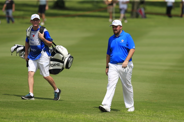 Shane Lowry (IRL) Team Europe and caddy Dermot Byrne on the 9th hole during Match 4 of Saturday's Foursome Matches of the 2016 Eurasia Cup presented by DRB-HICOM, held at the Glenmarie Golf & Country Club, Kuala Lumpur, Malaysia. 16th January 2016. Picture: Eoin Clarke | Golffile All photos usage must carry mandatory copyright credit (© Golffile | Eoin Clarke)