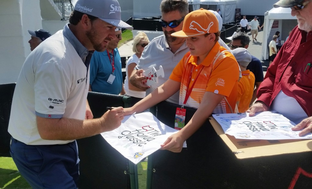 Fans line up for Graeme McDowell's autograph.