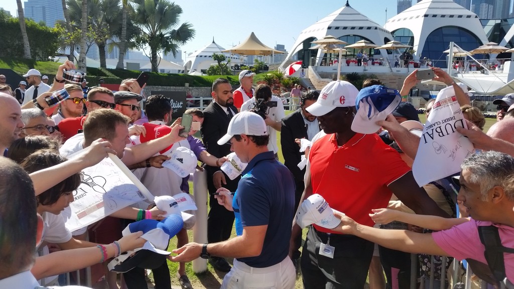 Security staff right to keep barricades from tipping over as Rory McIlroy signs autographs.  (Photo - www.golfbytourmiss.com)