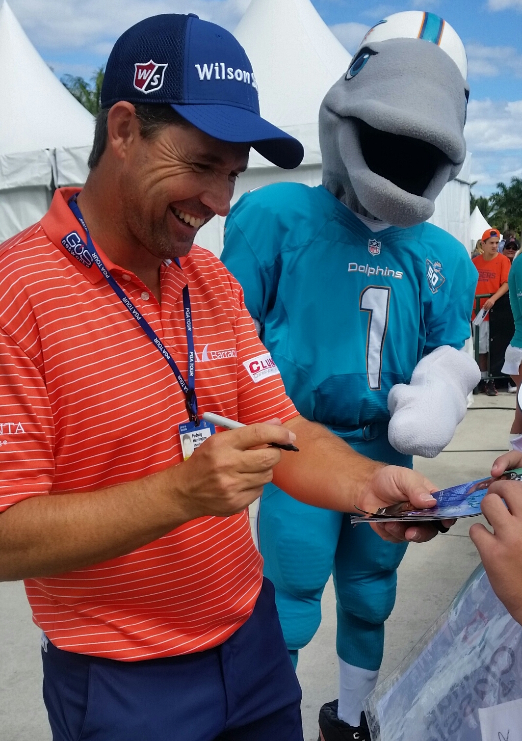 Miami Dolphins mascot 'T D' clearly enjoying Harrington's company