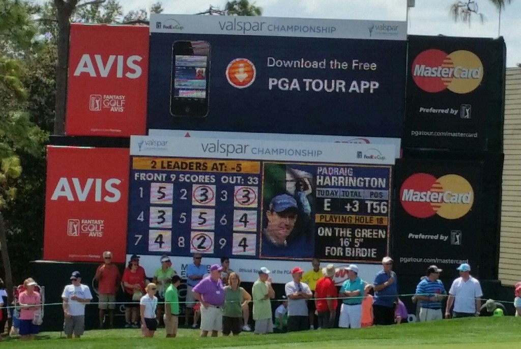 Padraig Harrington details on the electronic score board to the side of the 18th.