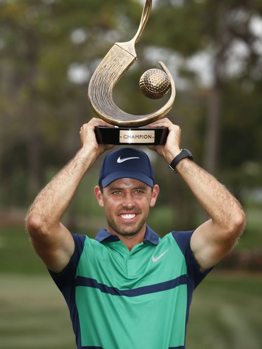 Charl Schwartzel points the Valspar trophy skywards but it was his index finger pointing to the putting surfaces that proved pivotal in his capturing only a second PGA Tour title.