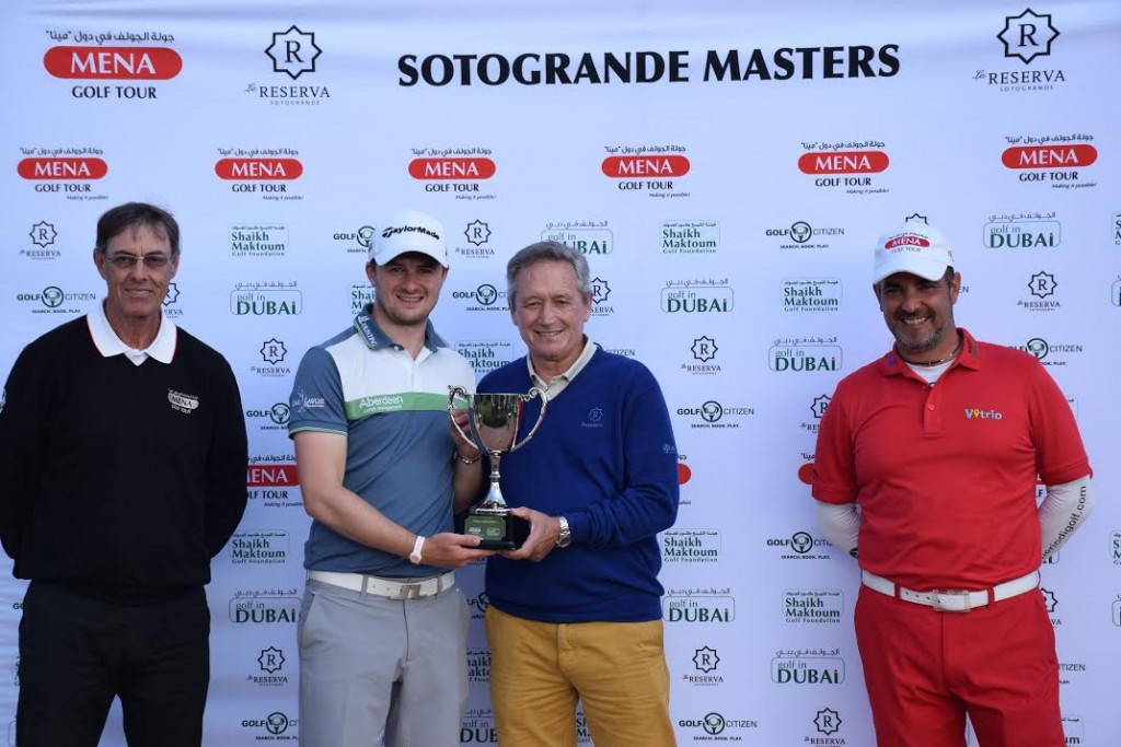 Scotland’s David Law receiving the winner’s trophy from Spain’s Manuel Pinero, a nine-time winner on the European Tour, as MENA Golf Tour ambassador Carlos Balmaseda and Trevor Varri, the tournament director, look on. (Photo - MENA Tour)