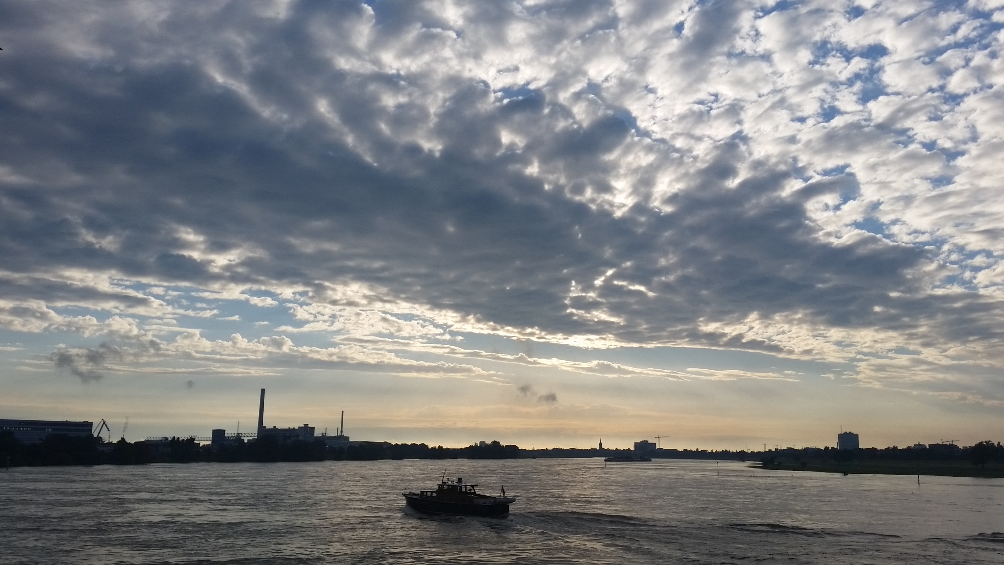 The sky lights up over the Rhein River at Dusseldorf.
