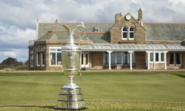 The Claret Jug sits with the clubhouse behind during the photocall at Royal Troon Golf Club, South Ayrshire. PRESS ASSOCIATION Photo. Picture date: Tuesday April 26, 2016. See PA story GOLF Open. Photo credit should read: Danny Lawson/PA Wire. RESTRICTIONS: Editorial use only - no commercial use. No onward sale. Still image use only. The Open Championship logo and clear link to The Open website (TheOpen.com) to be included on website publishing. Call +44 (0)1158 447447 for further