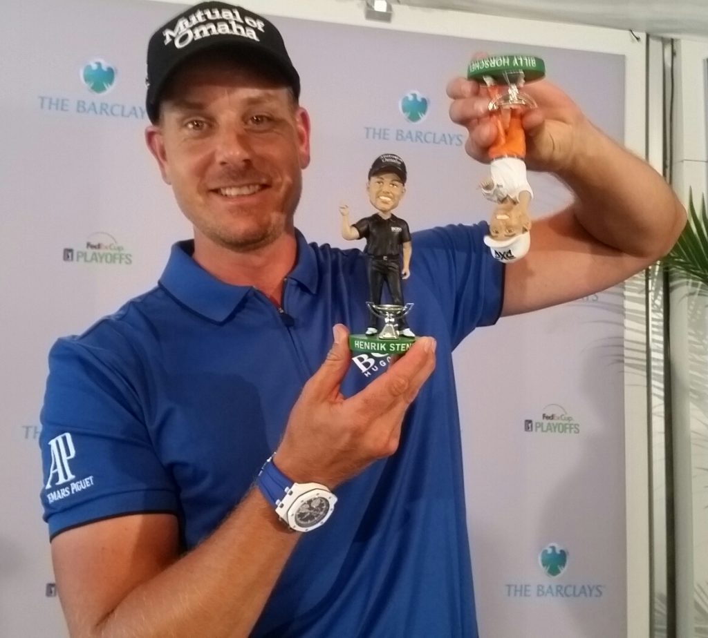 ... and Henrik Stenson has some fun with Billy Horshell's bobblehead.