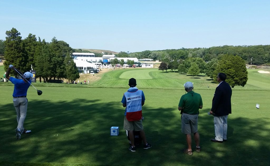 Masters champ Charl Schwartzel tees off the first on the Black course at Bethpage Park.