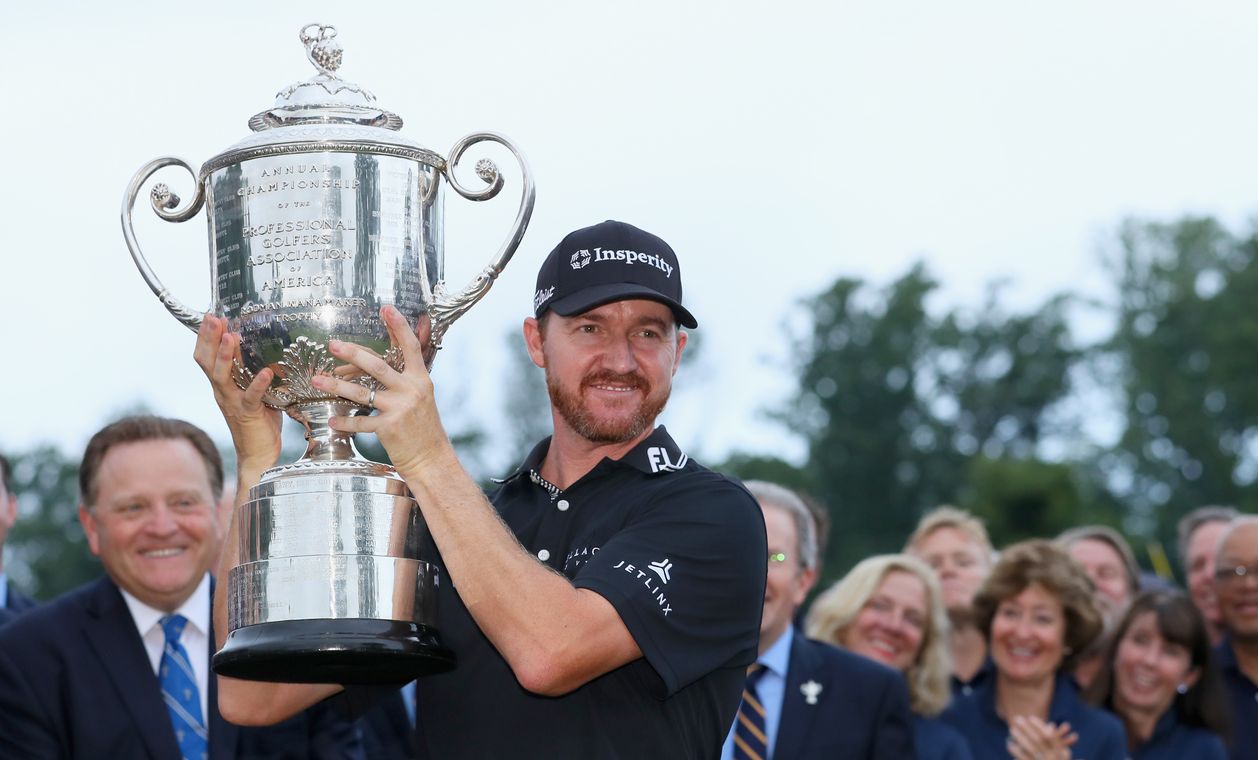 SPRINGFIELD, NJ - JULY 31: Jimmy Walker of the United States celebrates with the Wanamaker Trophy during the trophy presentation ceremony after winning the 2016 PGA Championship at Baltusrol Golf Club on July 31, 2016 in Springfield, New Jersey. (Photo by Andrew Redington/Getty Images)