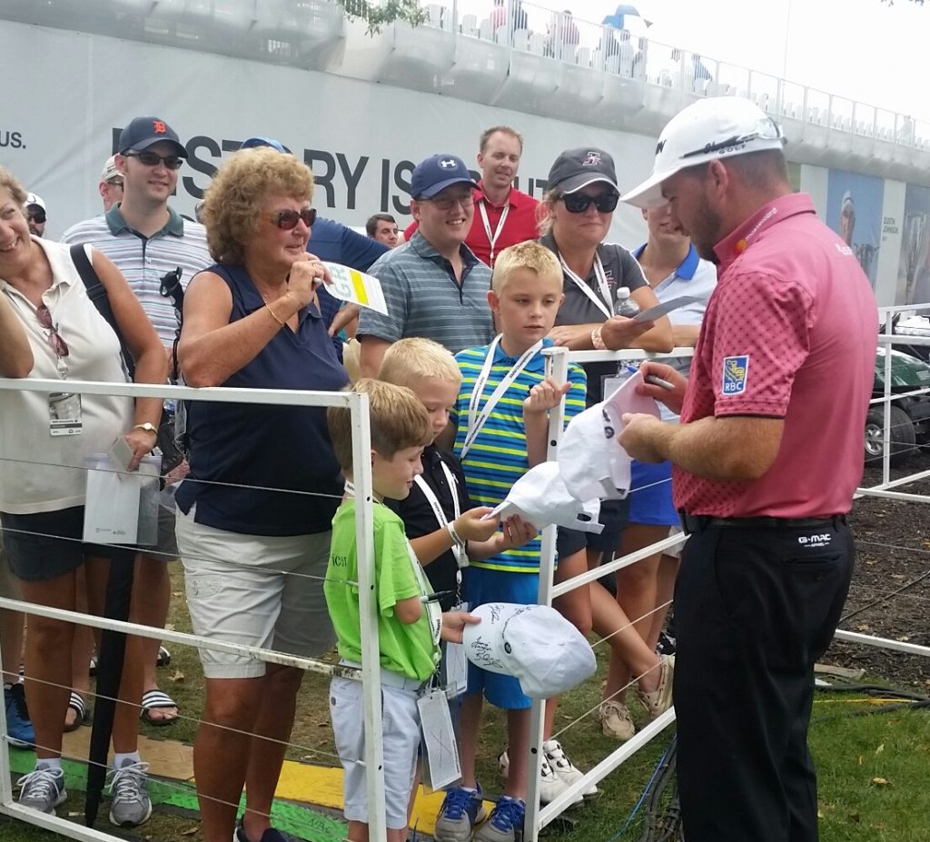 G Mac happily signs autographs after a round of 67 on day two of the BMW Championship. (Photo - www.golfbytourmiss.com)