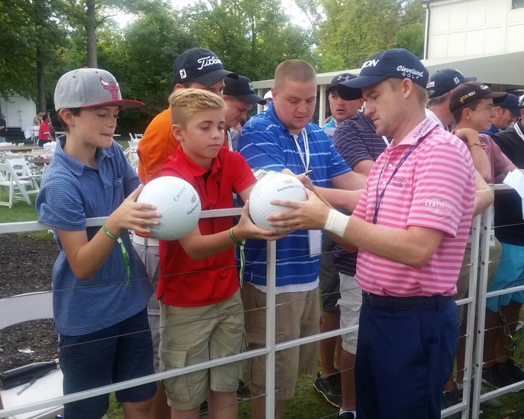 Scotland's top-ranked Russell Knox happily signing autographs after his round of 69 to move him to seven under par ... And Knox wearing pink in honour of Arnold Palmer's 87th birthday.