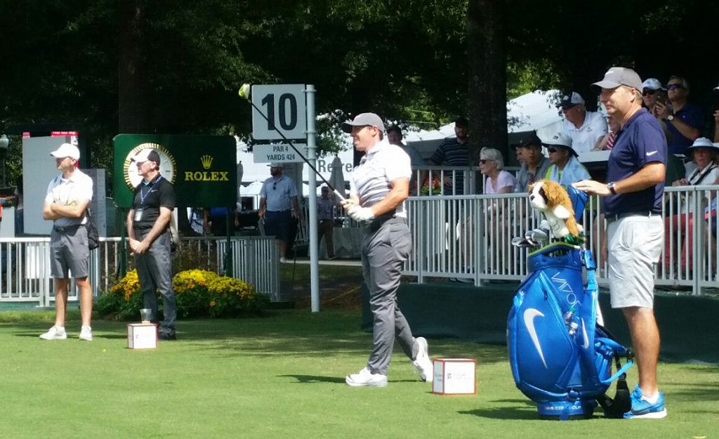 Rory McIlroy gets his back nine under way Wednesday as long-time coach, Michael Bannon and fitness coach, Steve McGregor (shorts) look on. (Photo - www.golfbytourmiss.com)