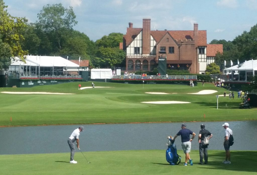 McIlroy hitting a 6-iron into the par five 18th at the East Lake GC. (Photo - www.golfbytourmiss.com)