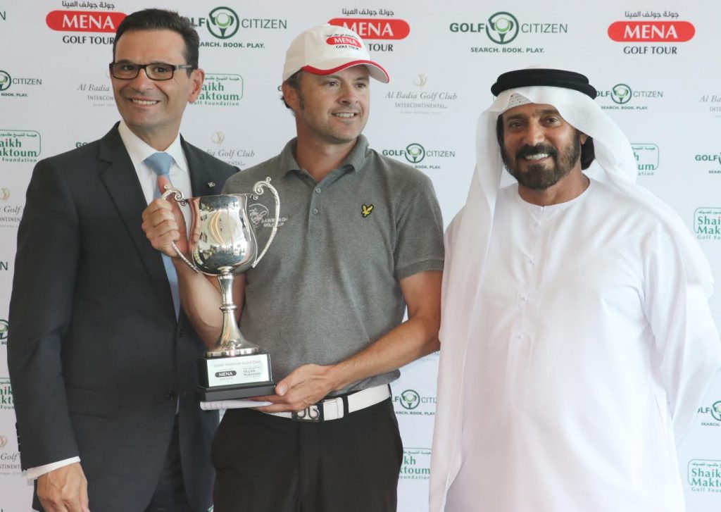 Shaikh Maktoum Dubai Open winner Andrew Marshall of England with James Koratzopoulos of Dubai Festival City and Mohamed Juma Buamaim, chairman of the MENA Golf Tour, at Al Badia Golf Club on Wednesday