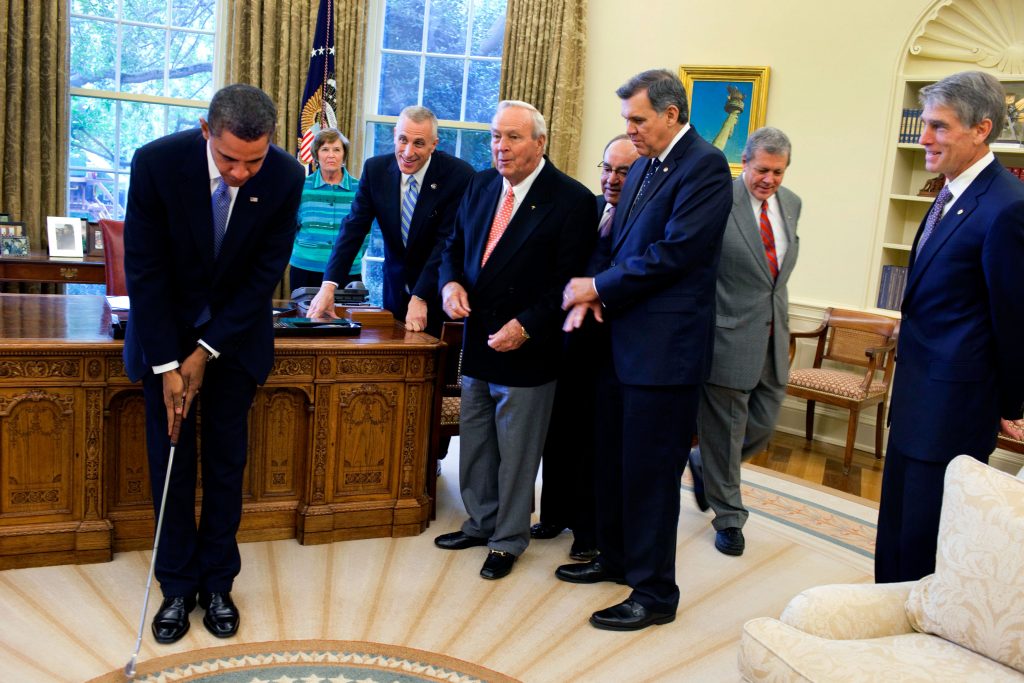 President Barack Obama practices with a golf club after the signing ceremony for H.R. 1243, the Arnold Palmer Congressional Gold Medal Act, in the Oval Office, Sept. 30, 2009. (Official White House photo by Samantha Appleton) This official White House photograph is being made available only for publication by news organizations and/or for personal use printing by the subject(s) of the photograph. The photograph may not be manipulated in any way and may not be used in commercial or political materials, advertisements, emails, products, promotions that in any way suggests approval or endorsement of the President, the First Family, or the White House.