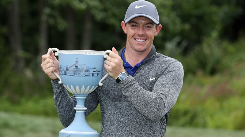 Rory McIlroy creates a storm of his own to win