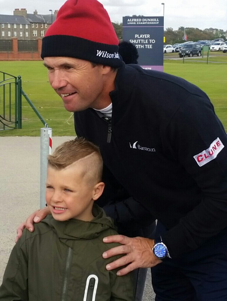What he does so well ... Padraig Harrington engaging with his younger fans and on day one of the Alfred Cunhill Links Championship at Carnoustie. 