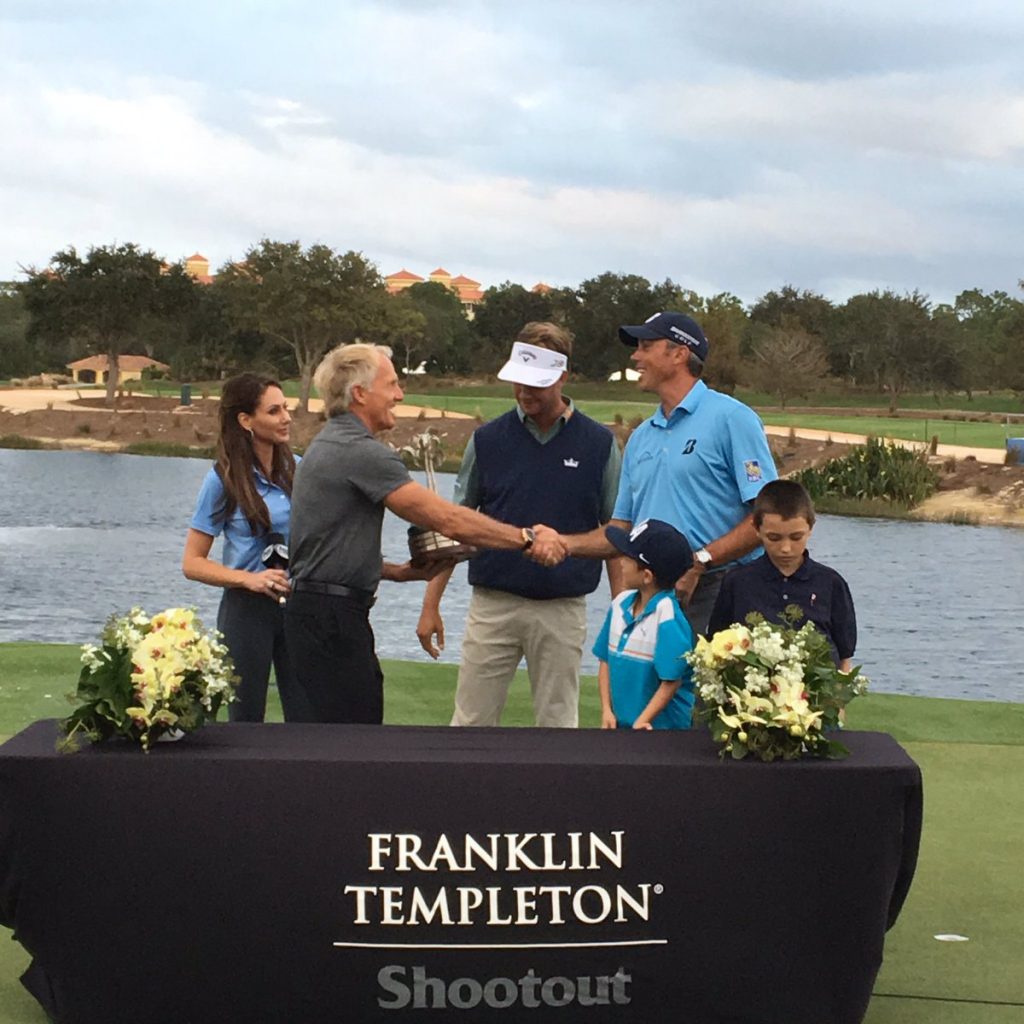 Tournament host Greg Norman congratulating Harris English and Matt Kuchar.
