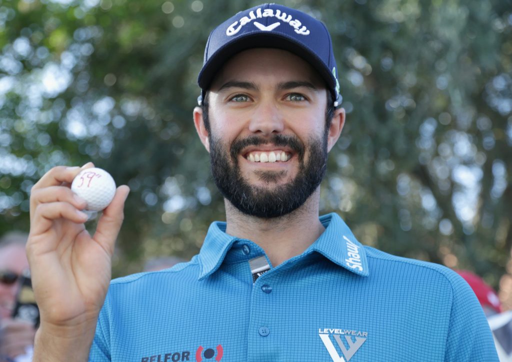 Canadian Adam Hadwin proudly shows off the ball he used to shoot the ninth score of 59 or better on the PGA Tour.