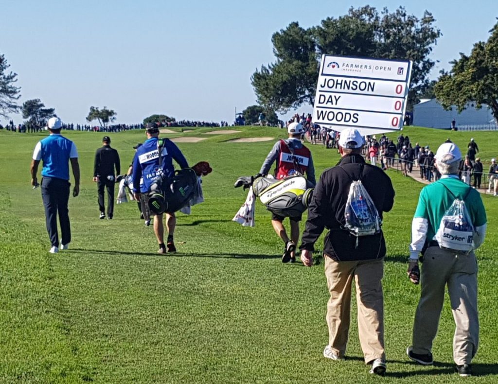 Tiger Woods heads down the 1st fairway much to the delight of golf fans around the globe.
