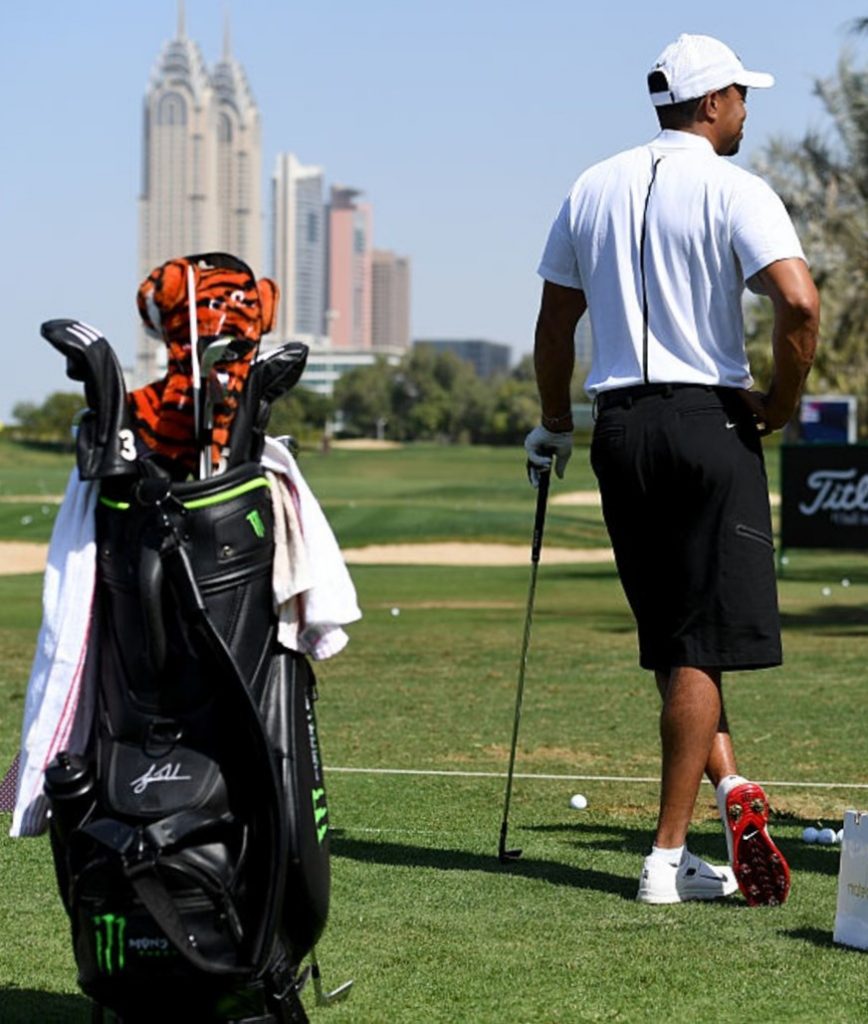 Tiger Woods on the practice range at the Emirates Club and wearing shorts given it is a European Tour event.