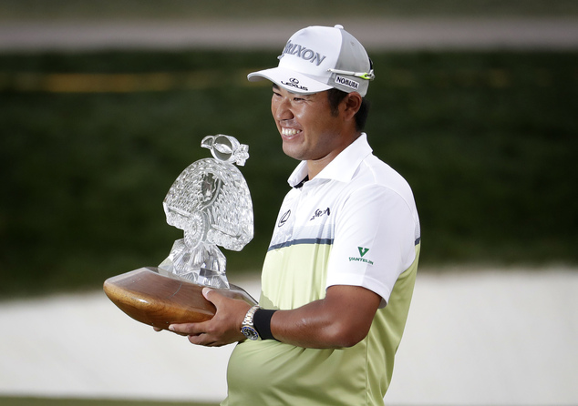 Hideki Matsuyama holds the champion's trophy after the Waste Management Phoenix Open golf tournament, Sunday, Feb. 5, 2017, in Scottsdale, Ariz. (AP Photo/Matt York)