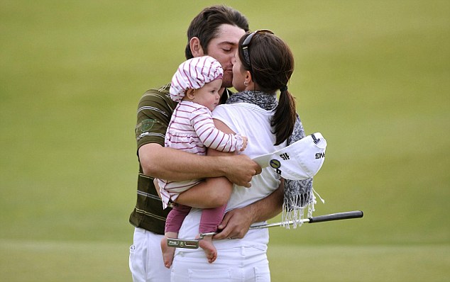 South Africa's Louis Oosthuizen (left) celebrates with a kiss for his wife Nel-Mare after winning The Open Championship 2010 at St Andrews, Fife, Scotland. PRESS ASSOCIATION Photo. Picture date: Sunday July 18, 2010. See PA Story GOLF Open. Photo credit should read: Rebecca Naden/PA Wire. RESTRICTIONS: Use subject to restrictions. Editorial use only. No commercial use. Call +44 (0)1158 447447 for further information.