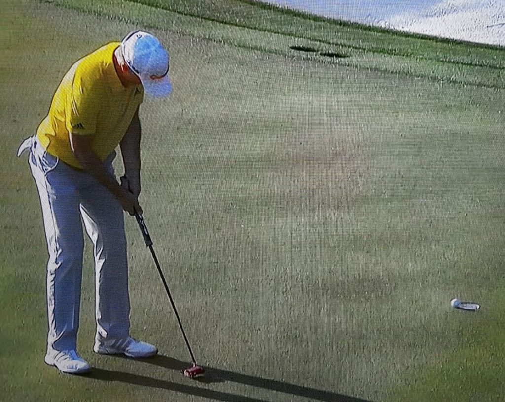 Martin Laird's birdie putt about to disappear into the bottom of the cup.